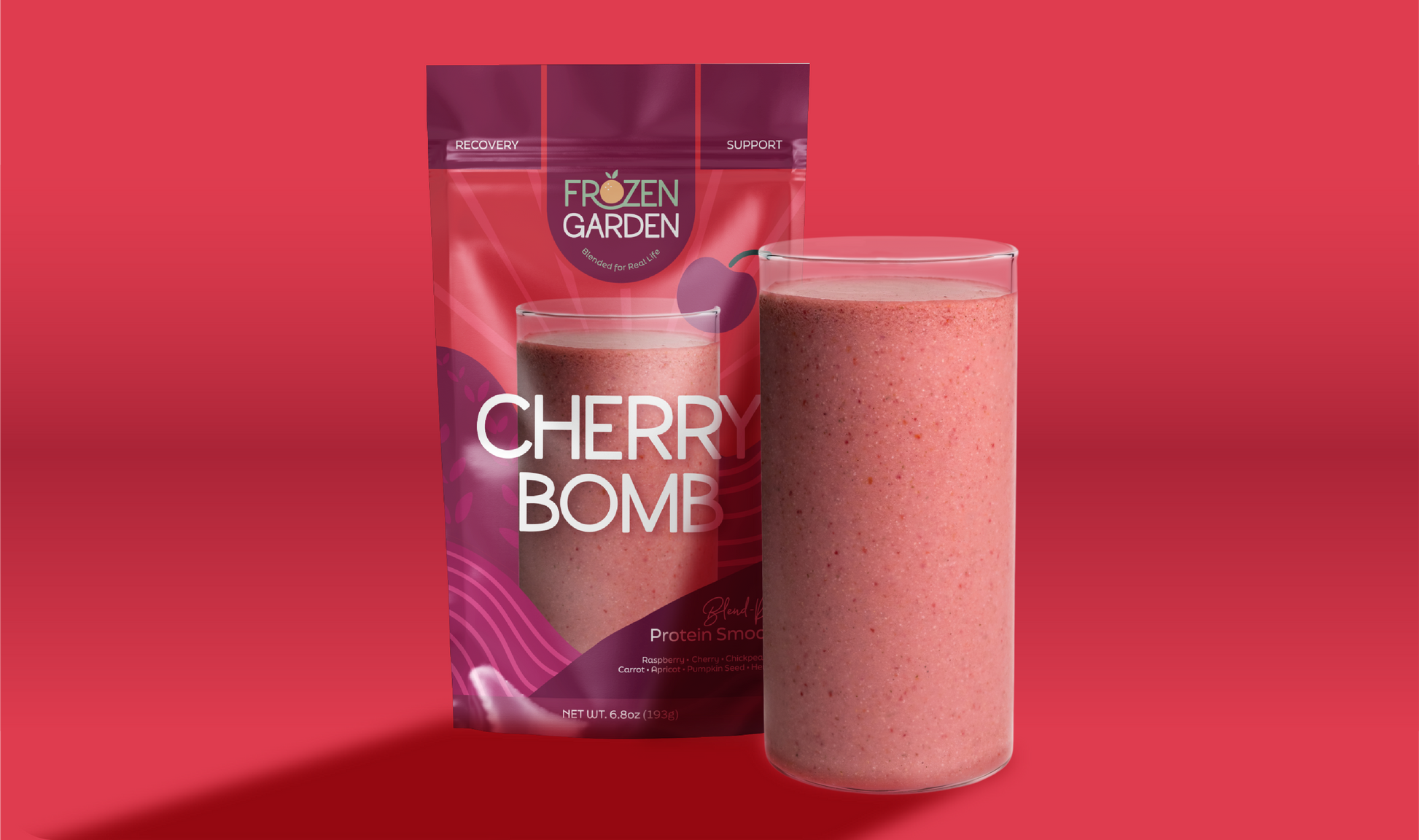 Cherry Bomb smoothie pouch beside blended glass - Frozen Garden ready to blend smoothie with cherry and mango.