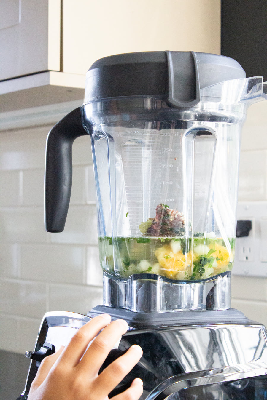Frozen Garden smoothie ingredients being blended with water