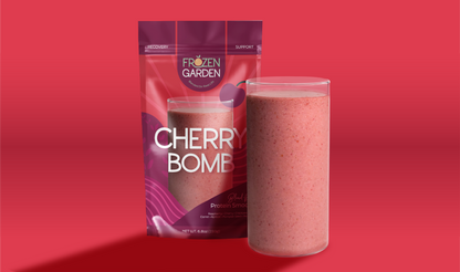 Cherry Bomb smoothie pouch beside blended glass - Frozen Garden ready to blend smoothie with cherry and mango.