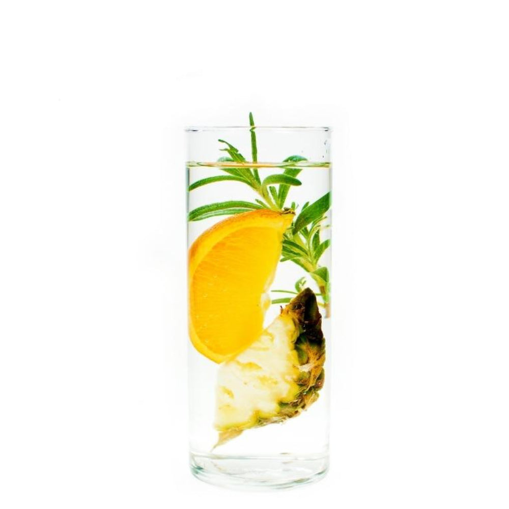 Orange-Pineapple-Rosemary ingredients floating in water in clear glass
