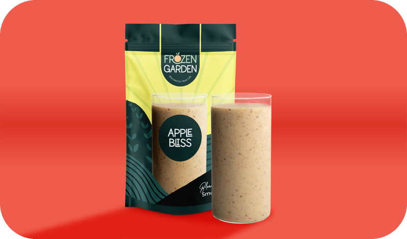Apple Bliss smoothie pouch beside blended glass - Frozen Garden ready to blend smoothie with apple and banana.