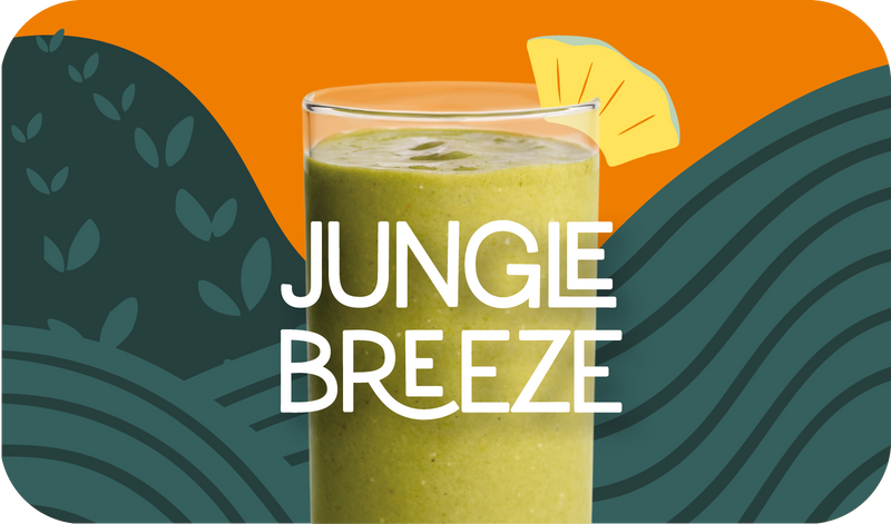 Blended Jungle Breeze smoothie in glass, light green color with tropical fruit design - Frozen Garden healthy tropical smoothie.