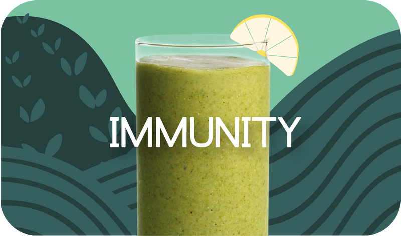 Blended Immunity smoothie in glass, golden yellow color with citrus design - Frozen Garden healthy immune support smoothie.