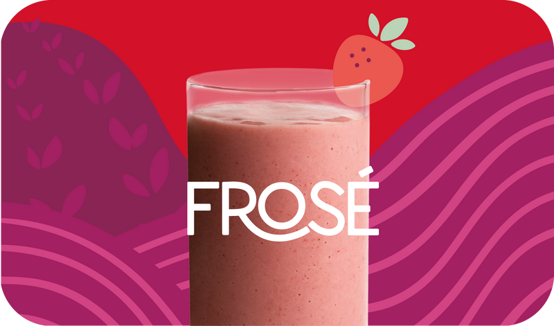 Blended Frosé smoothie in glass, bright pink color with strawberry design - Frozen Garden healthy frozen fruit smoothie.
