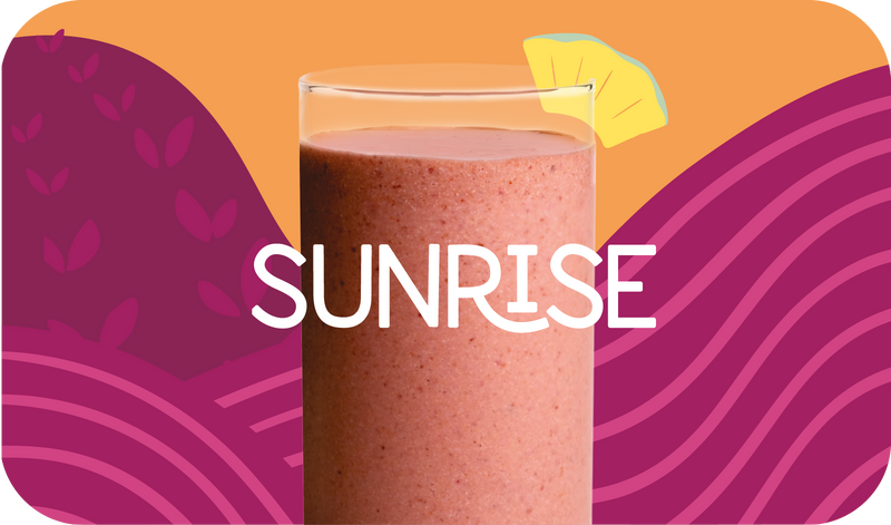 Blended Sunrise smoothie in glass, bright orange color with citrus design - Frozen Garden healthy tropical smoothie.