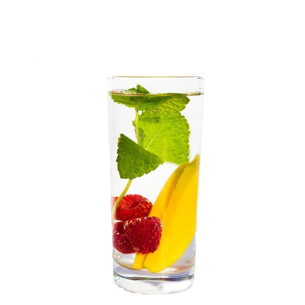 Raspberry-Mango-Mint Fusion Beverage Infuser ingredients floating in water in a clear glass