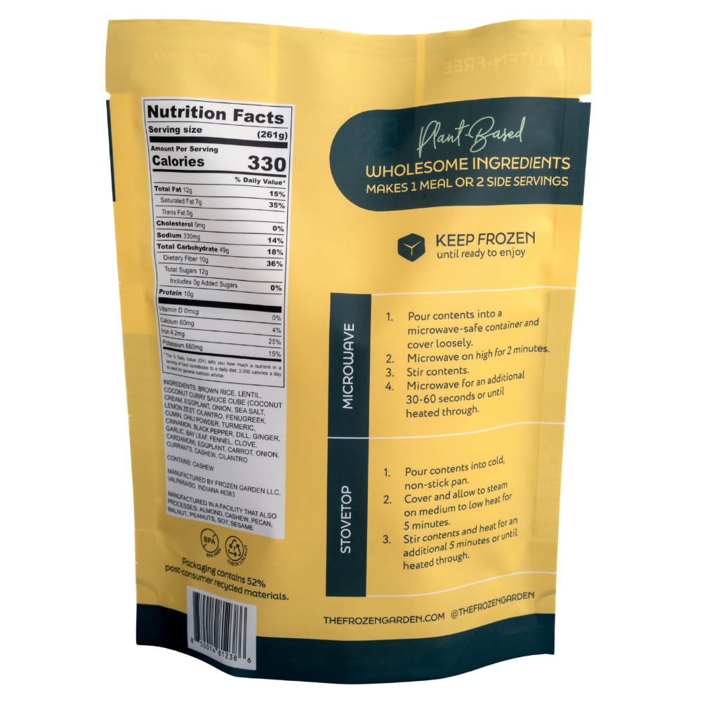 Coconut Curry Garden Bowl pouch back on white background with brown rice, carrots and eggplant - Frozen Garden plant-based meal.