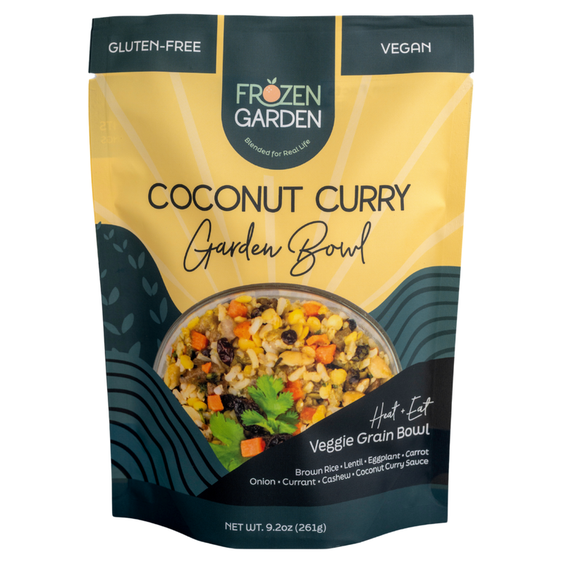 Coconut Curry Garden Bowl pouch on white background with brown rice, carrots and eggplant - Frozen Garden plant-based meal.