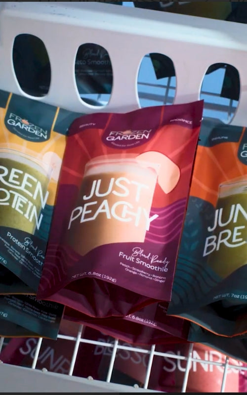Assorted frozen smoothie packages on a metal freezer rack