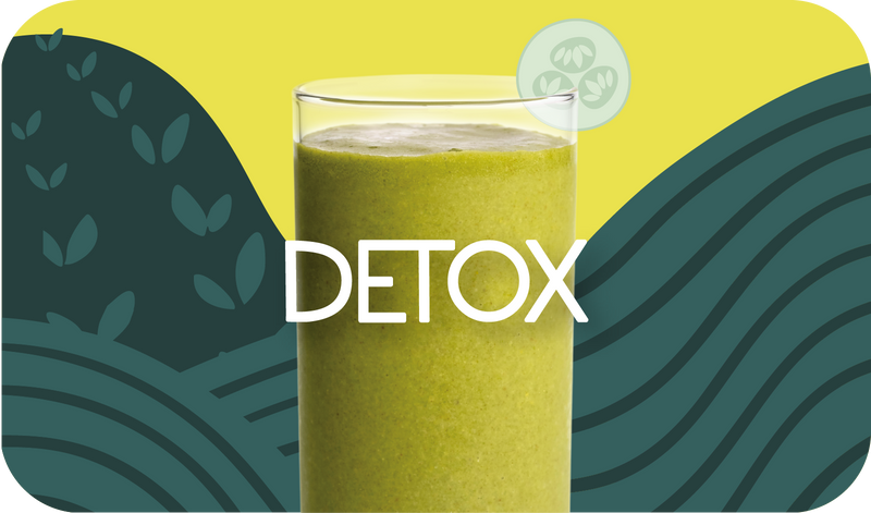 Blended Detox smoothie in glass, light green color with cucumber design - Frozen Garden healthy detox smoothie.