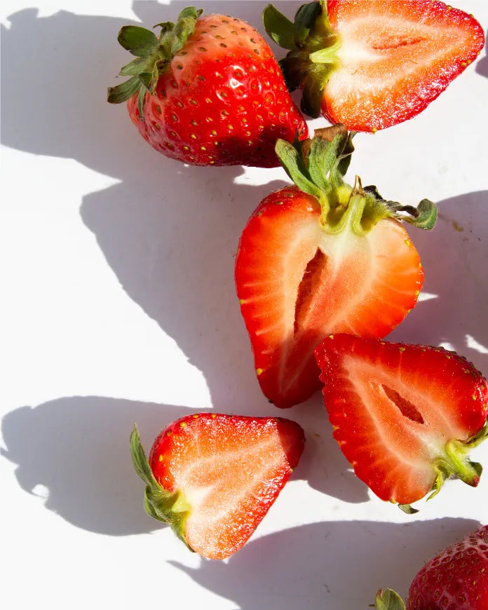 Close-up of fresh cut strawberries, a high-water content fruit used in Frozen Garden ready-to-blend smoothies like for natural hydration and sweetness.