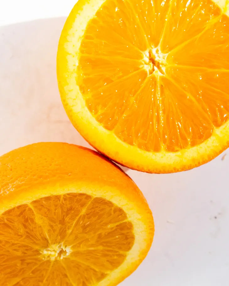 Close-up of fresh orange slices, a juicy high-water content fruit used in Frozen Garden ready-to-blend smoothies for natural hydration without powders or fillers.