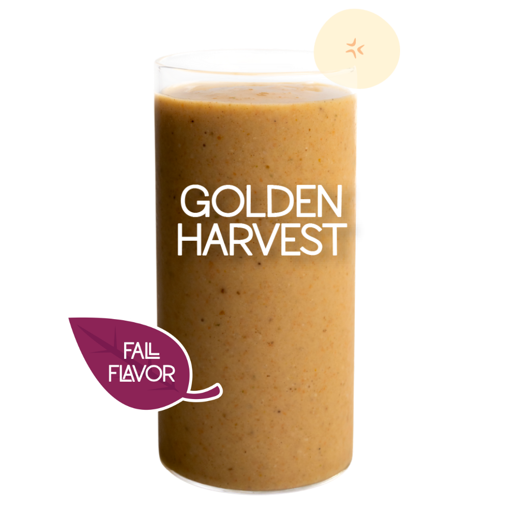 Blended Golden Harvest smoothie in glass on clear background - Frozen Garden banana and carrot smoothie.
