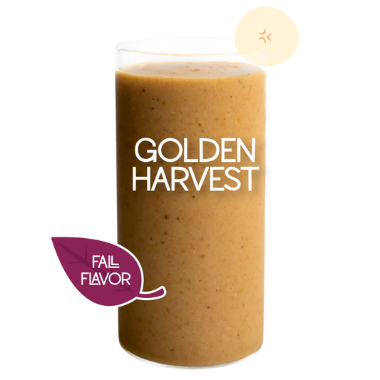 Blended Golden Harvest smoothie in glass on clear background - Frozen Garden banana and carrot smoothie.