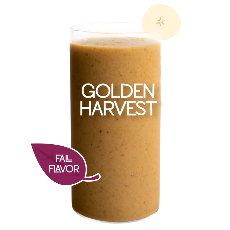 Blended Golden Harvest smoothie in glass on clear background - Frozen Garden banana and carrot smoothie.