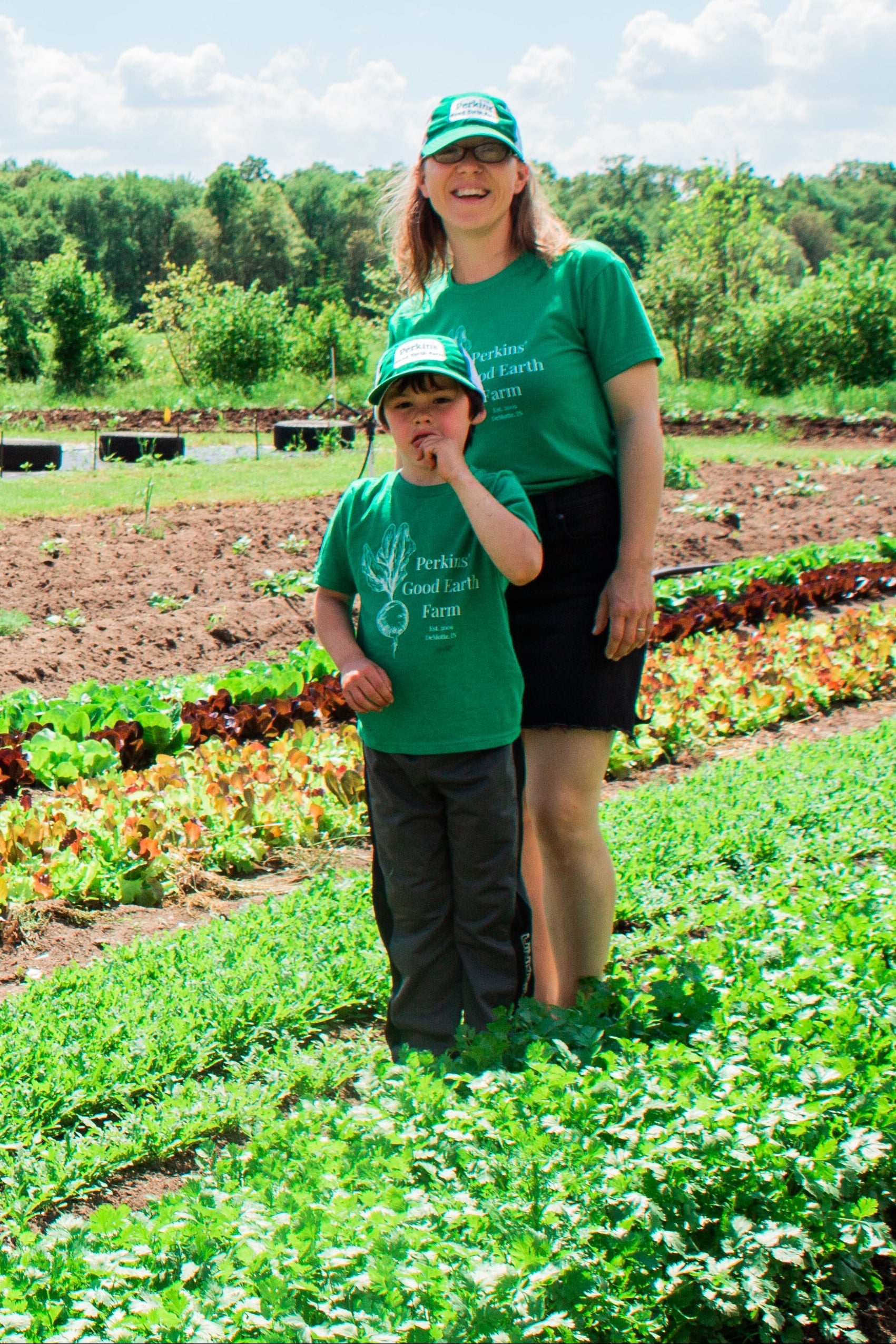 Perkins family standing in field where local smoothie ingredients are grown.
