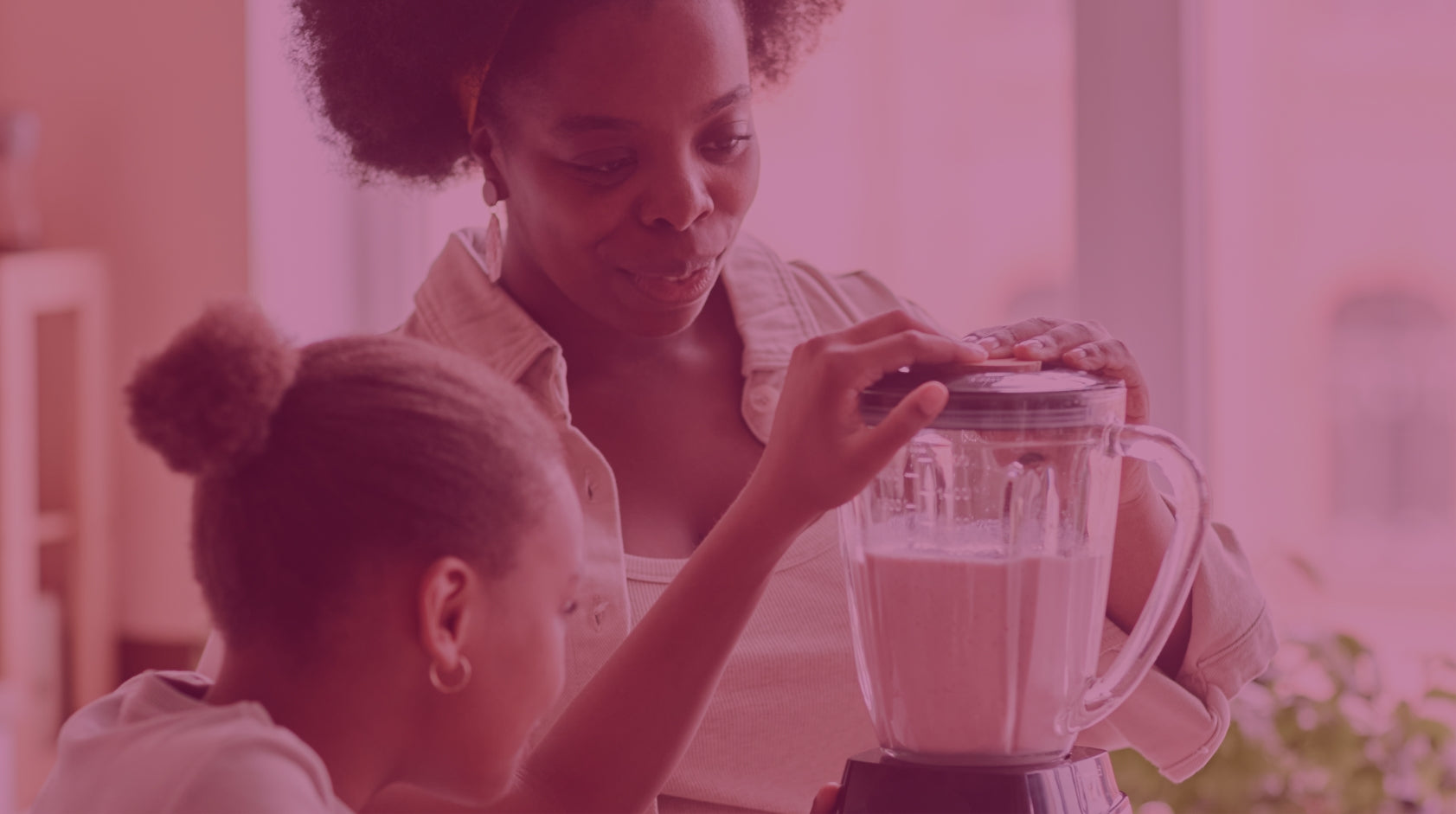 Woman and child blending a Frozen Garden ready to blend smoothie.