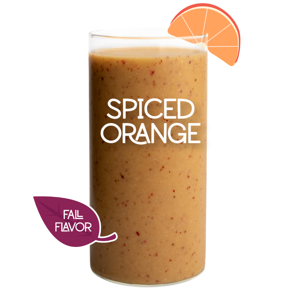 Blended Spiced Orange smoothie in glass on white background - Frozen Garden pumpkin spice smoothie.