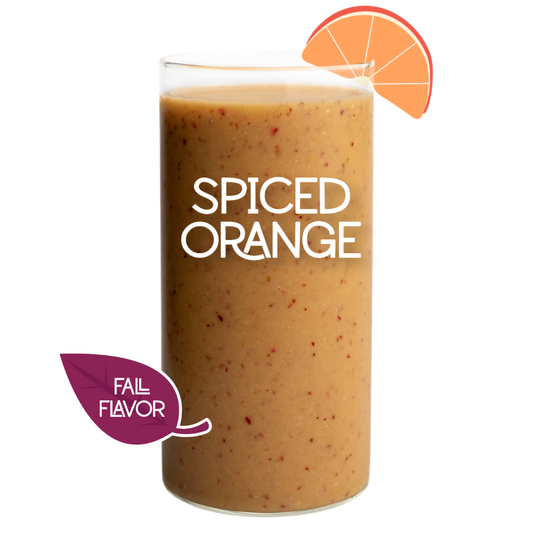 Blended Spiced Orange smoothie in glass on white background - Frozen Garden pumpkin spice smoothie.
