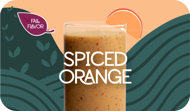 Blended Spiced Orange smoothie in glass, bright orange color with citrus design - Frozen Garden healthy pumpkin smoothie.