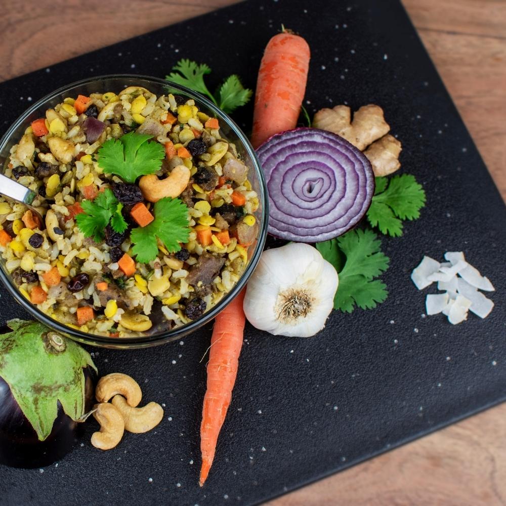 Coconut Curry Garden Bowl prepared with ingredients spread around the bowl. 